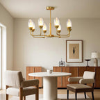 Minimalist chandelier above a midcentury dining setting