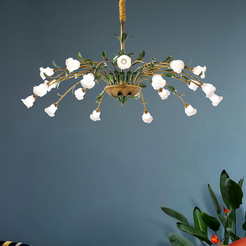 Floral chandelier above a blue chair in an eclectic room