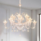 Art glass chandelier in a minimalist white bedroom