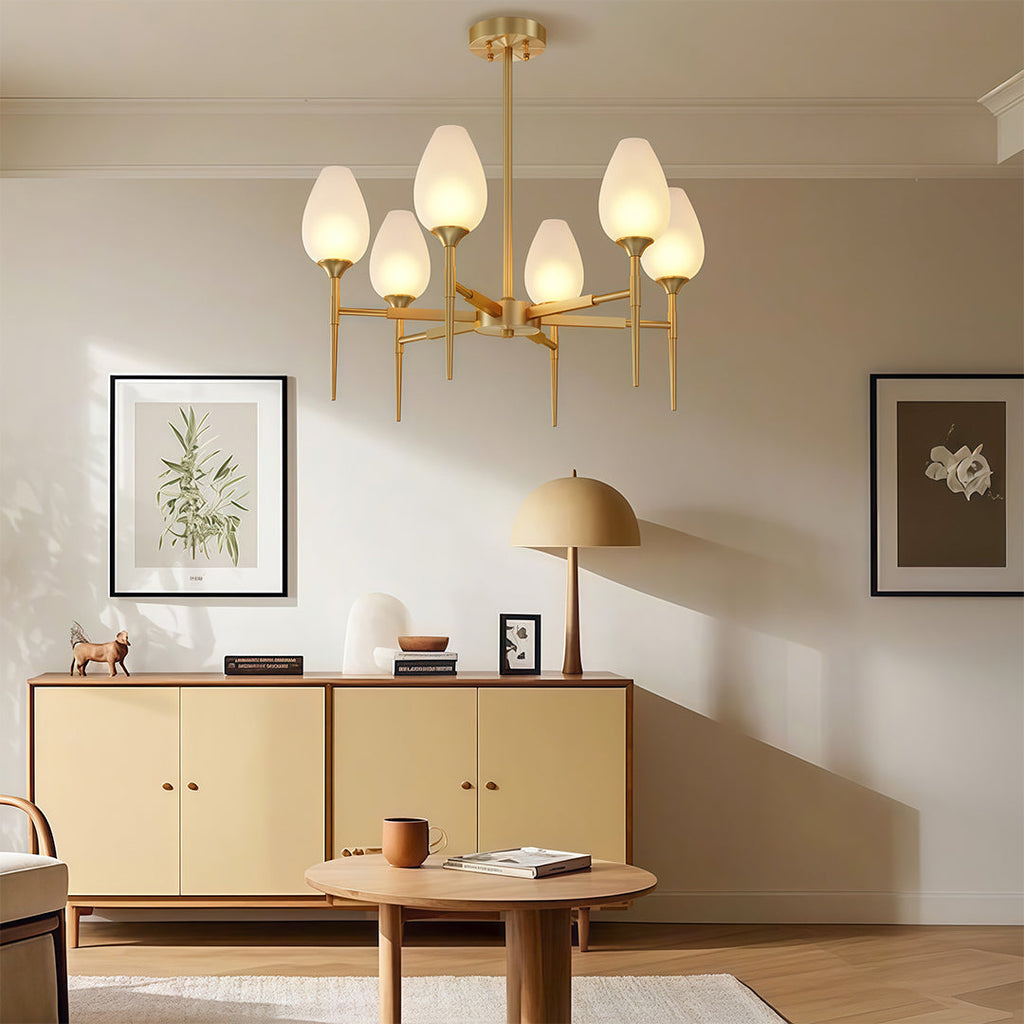 Glass chandelier above a credenza in a minimalist living room