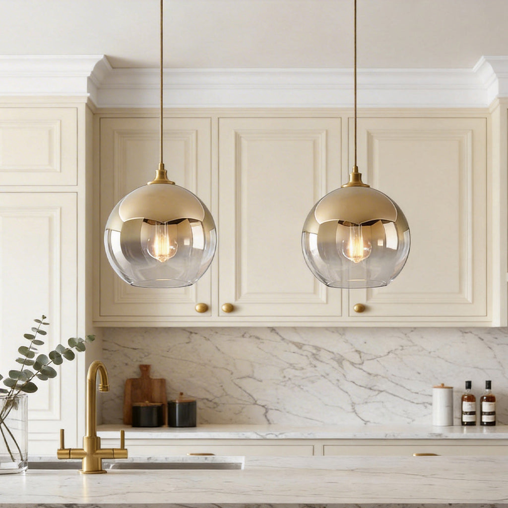 Elegant glass globe pendant light above a kitchen island