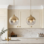 Elegant glass globe pendant light above a kitchen island