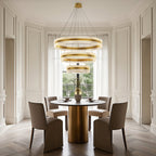 Gold finish circular chandelier in a stylish dining room
