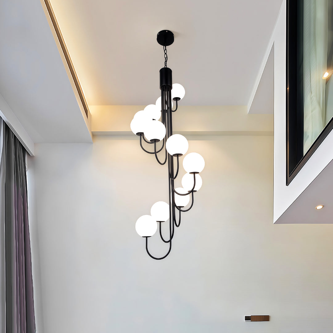 Elegant gold spiral globe chandelier shown fully lit