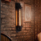 Industrial sconce with exposed bulb on a rustic brick wall