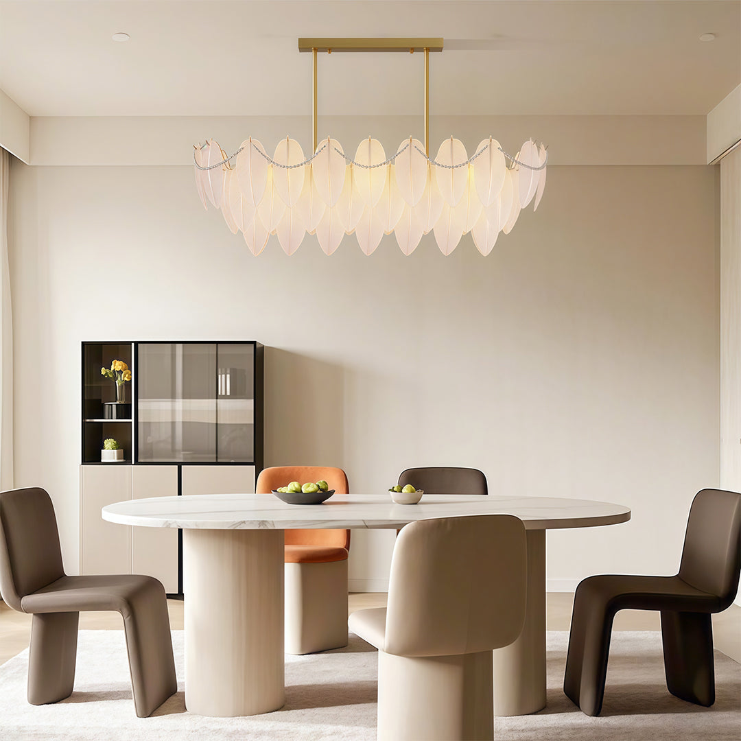 Pearl feather chandelier in a bright kitchen with white cabinetry