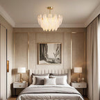 Pearl feather chandelier in a cozy living room with pillows