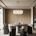 Feather chandelier in a living room with arched windows