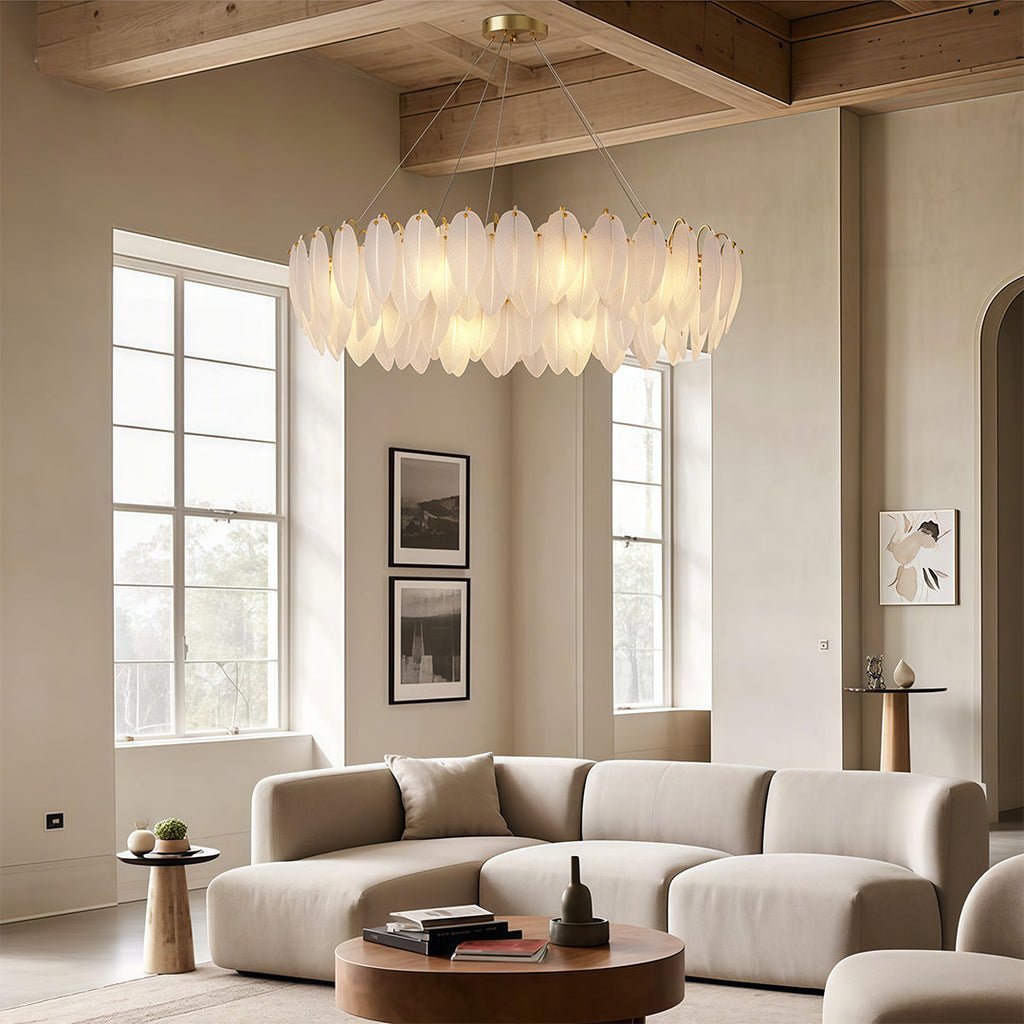 Feather chandelier in a spacious living room with tall windows