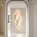 Backlit feather wall light beside an arched doorway