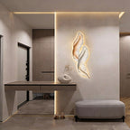 Backlit feather wall light above a hallway console table