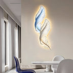 Backlit feather wall light in a minimalist room