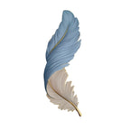 Blue and white feather wall lamp in vertical orientation