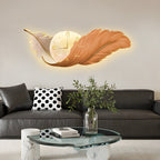 Feather wall lamp with clock above a living room sofa