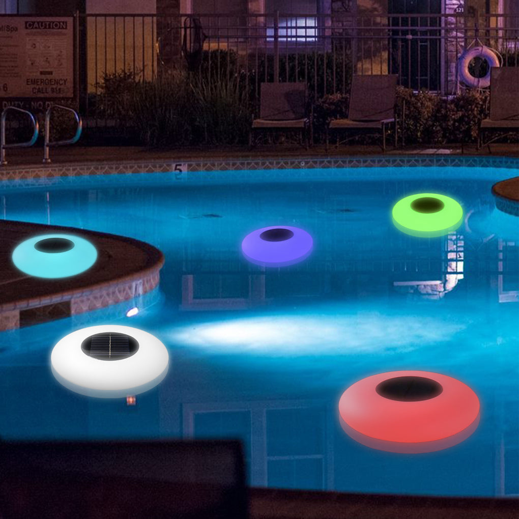 Floating pond light changing color in a swimming pool