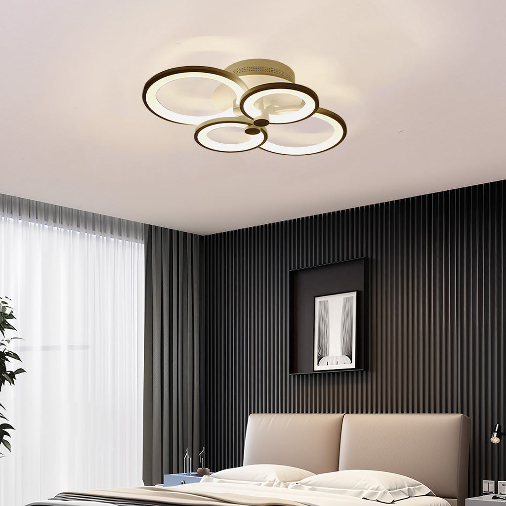Semi flush mount multi ring ceiling light in a bedroom