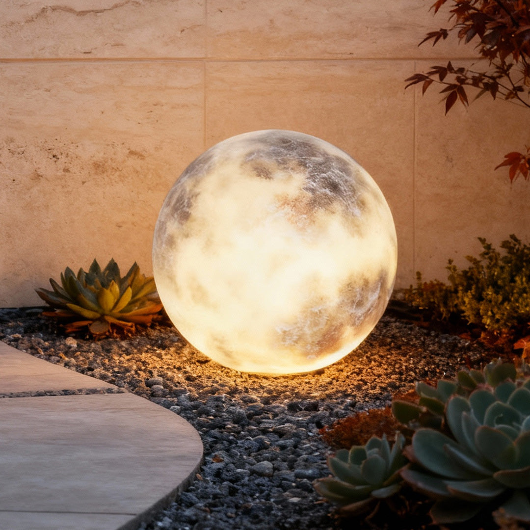 Moon globe light glowing as a sphere in a garden landscape