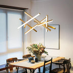 Gold and white geometric ceiling light in a dining room