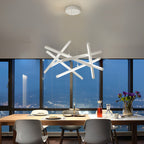 White geometric ceiling light in a dining room