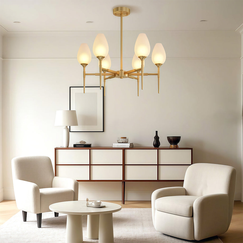 Glass chandelier beside a console in a contemporary dining room