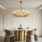 Glass drop chandelier above a fluted dining table
