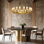 Glass drop chandelier above a warm textured gold table