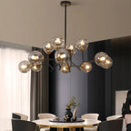 Glass globe chandelier hanging above a dining table