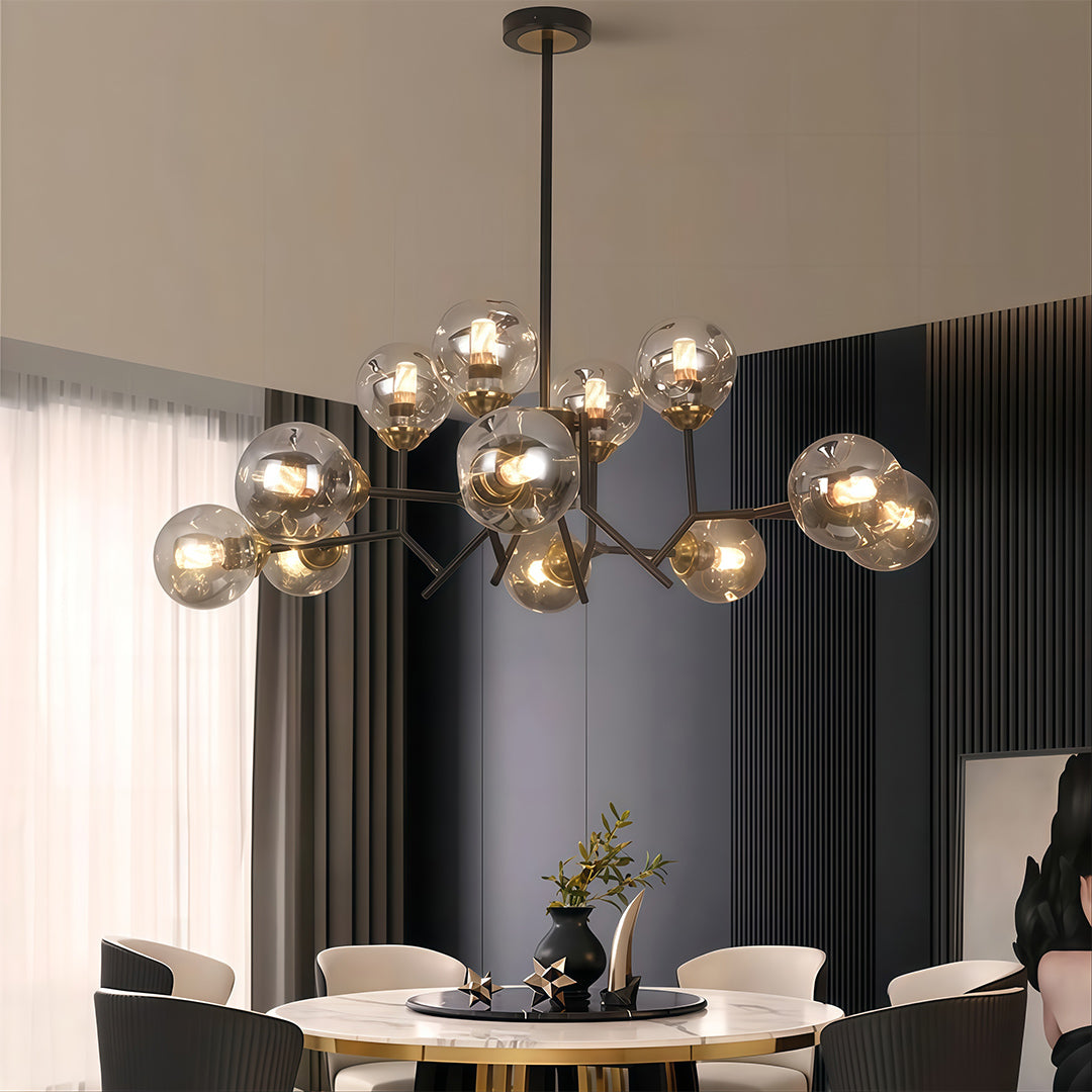 Glass globe chandelier hanging above a dining table