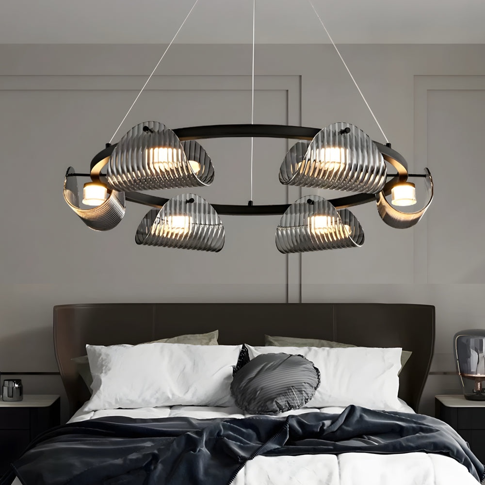 Glass ring chandelier above a minimalist dining table