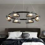 Glass ring chandelier above a minimalist dining table