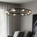 Glass ring chandelier glowing warm in a bedroom