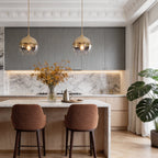 Glass globe pendant light hanging in a dining room