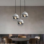 Glass globe pendant light hanging in a living room