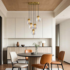 Glass semi flush light hanging in a bright dining room