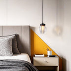 Glass semi flush light in a modern bedroom with yellow accents