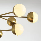 Close-up of the brass arm and white glass globe
