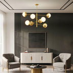 Globe chandelier in a contemporary living room with dark accents