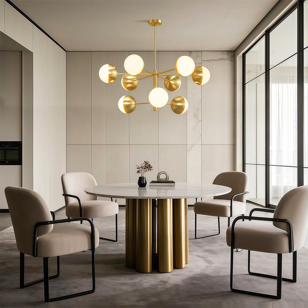 Globe chandelier above a dining table with upholstered chairs