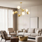 Globe chandelier in an elegant living room with a curved sofa