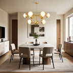Globe chandelier above a round table in a neutral dining room