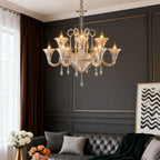 Gold art glass chandelier in a living room with dark walls