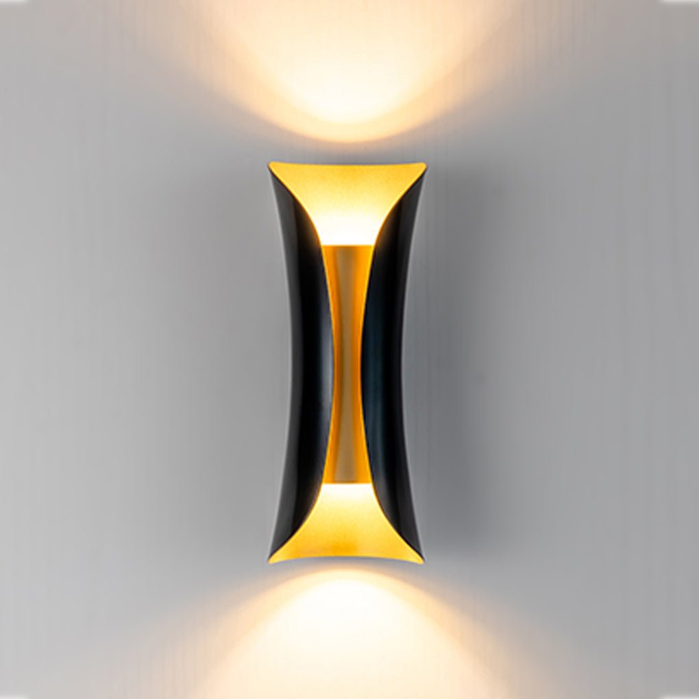 Gold and black up down wall light in a modern room