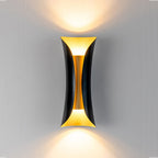 Gold and black up down wall light in a modern room