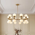 Gold bubble chandelier with frosted globes against wainscoting