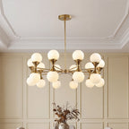 Gold bubble chandelier with frosted globes against wainscoting