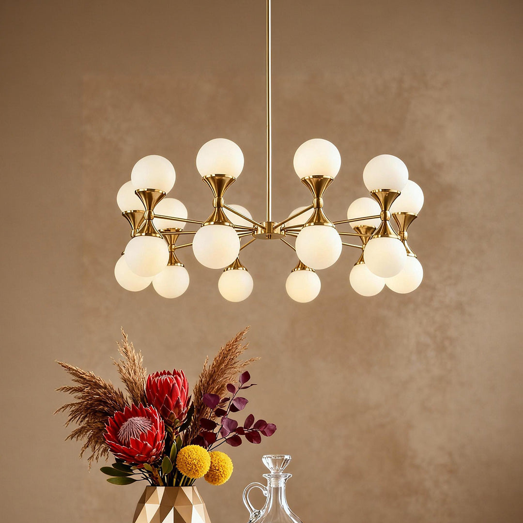 Gold bubble chandelier with frosted shades beside floral decor