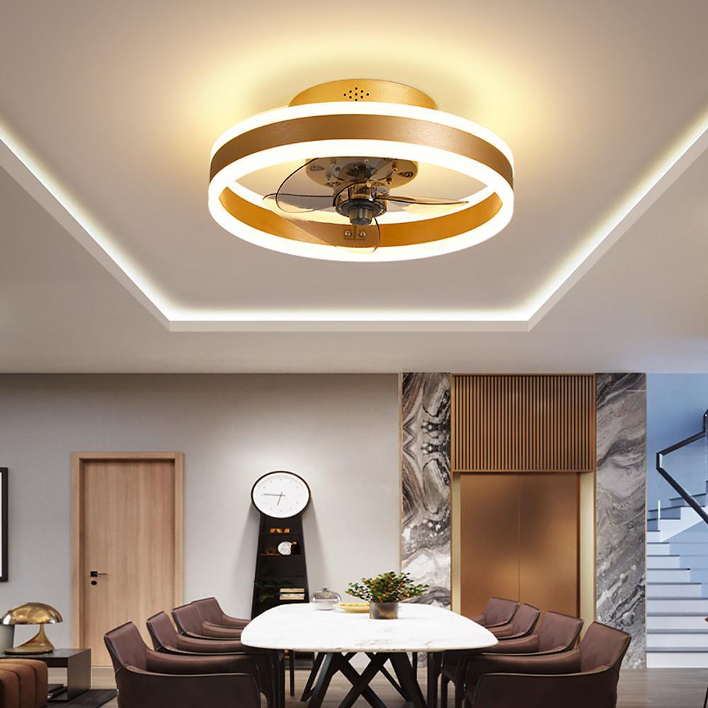 Gold ceiling fan with light in a dining room