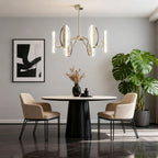 Gold cluster chandelier above a dining table in a gray room