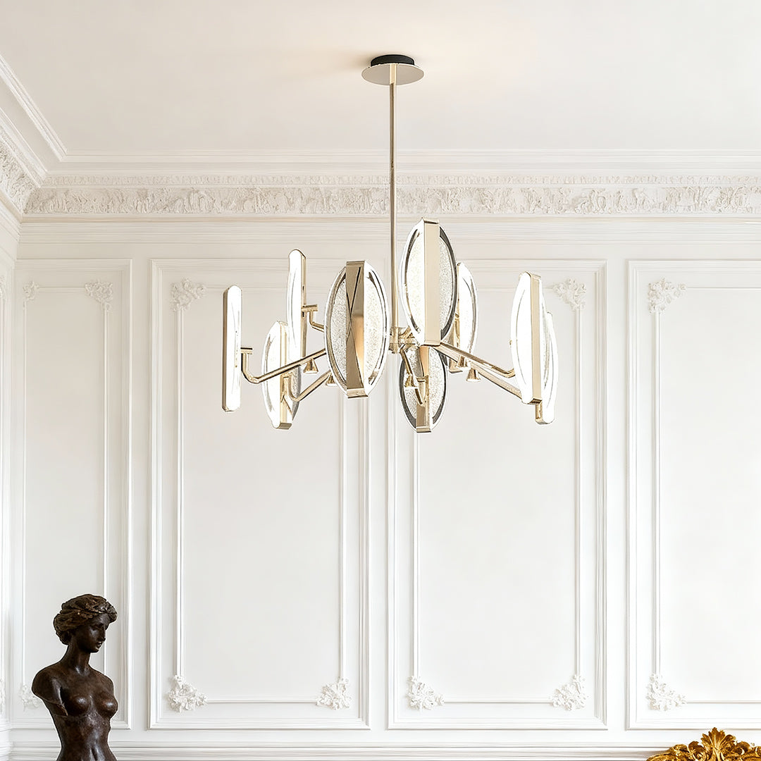Gold chandelier in a room with white wainscoting
