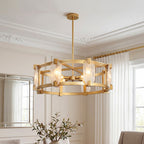 Gold drum chandelier with textured glass panels shown lit